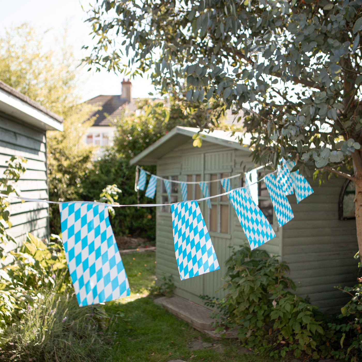 Blue and White Chequered Oktoberfest bunting hanging up outside 