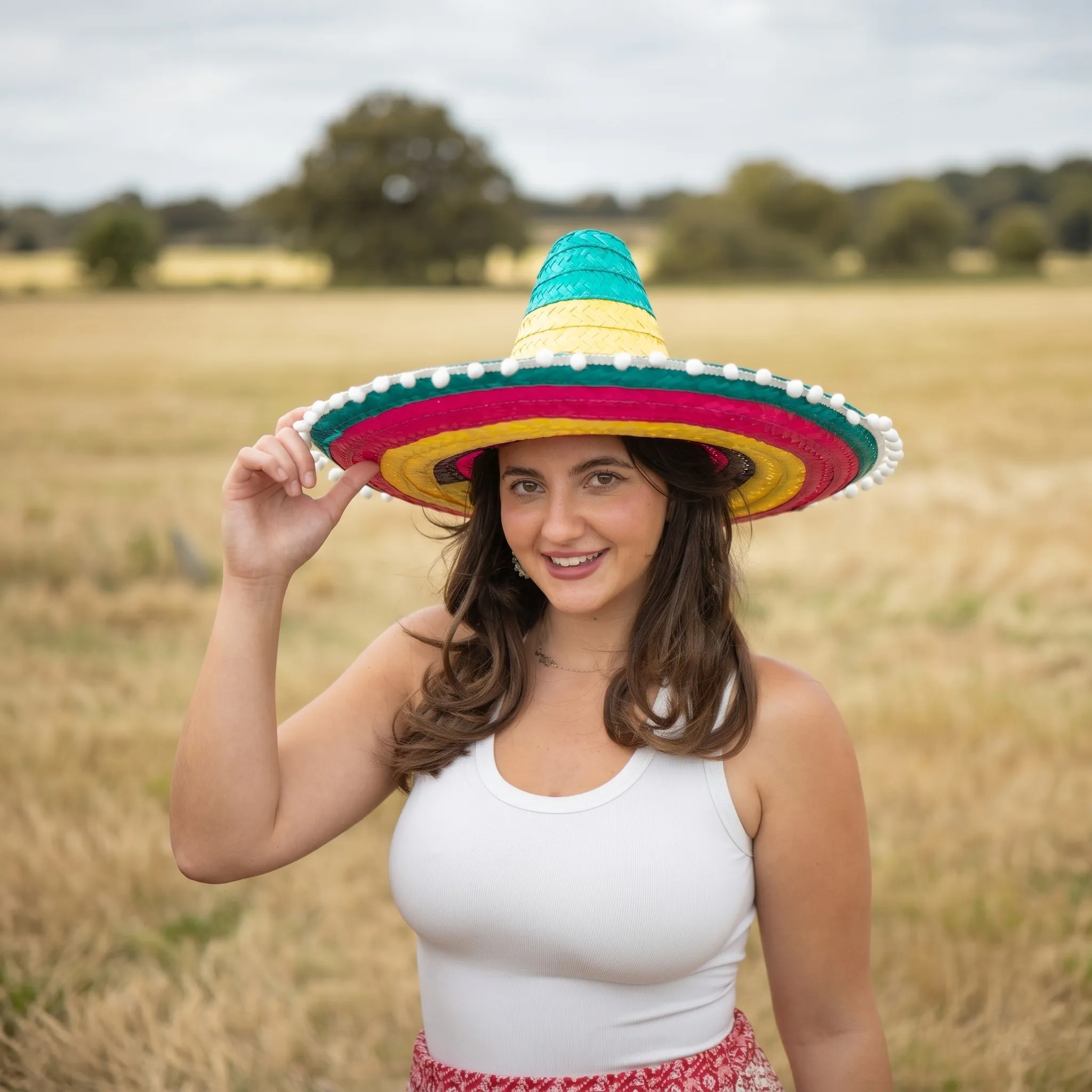 Collection of summer hats including cowboy hats, Hawaiian hats, straw boaters and festival headwear