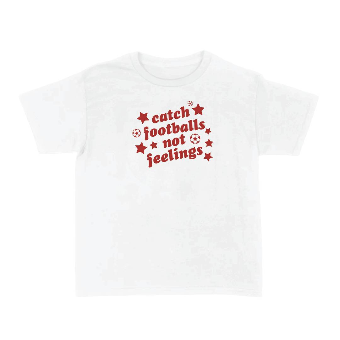 Ladies “Catch Footballs Not Feelings” Baby Tee | Women’s Funny Football Supporter Tee | White Slogan Top